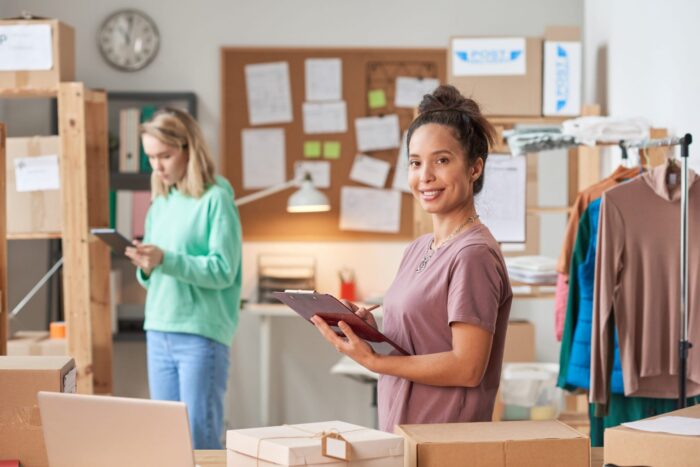 Photo of two businesswomen illustrates blog: How to Tell If Invoice Factoring Is a Good Idea for Your Business