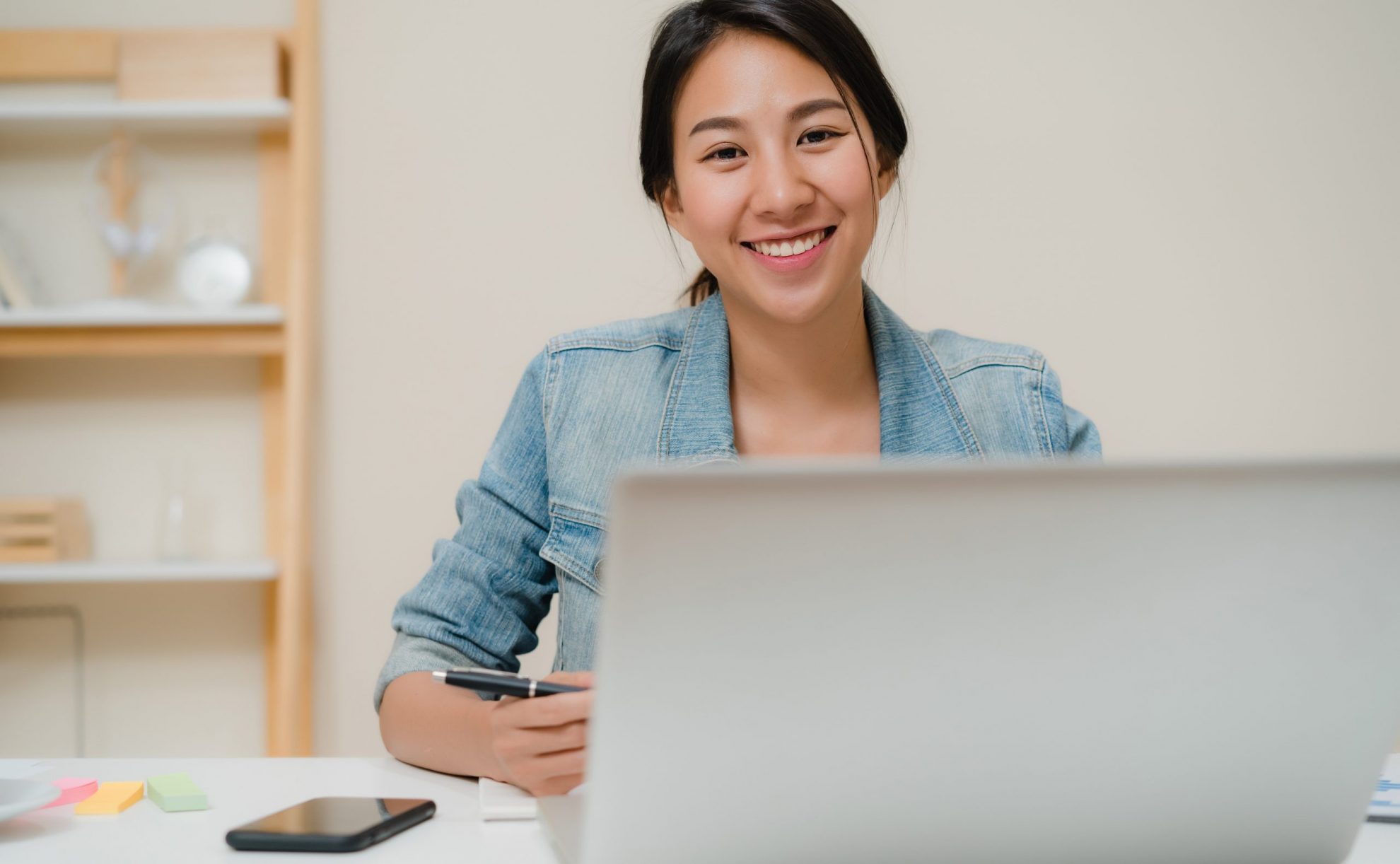 Image of smiling young businesswoman illustrates blog: "Factoring for new businesses: is it a good idea?"