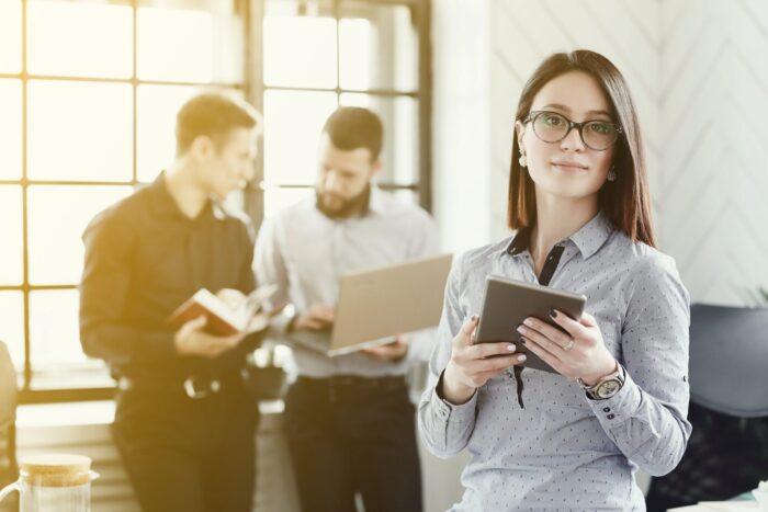 Photo of businesspeople illustrates blog: "Is receivables factoring debt?"