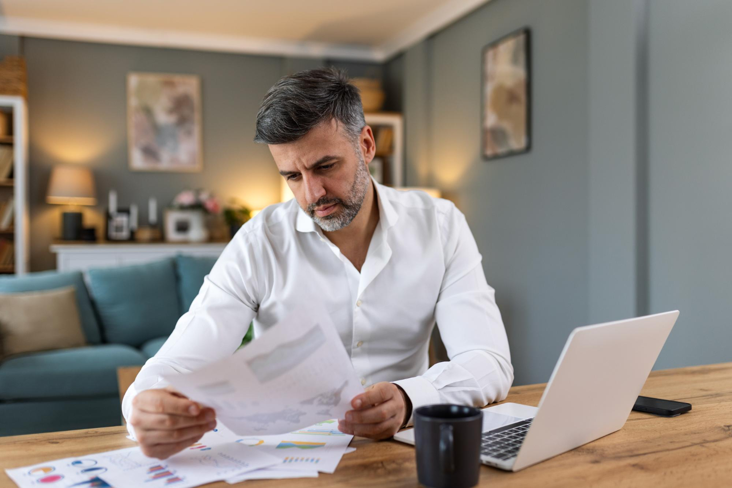 Business owner using digital invoice factoring in a paperless office