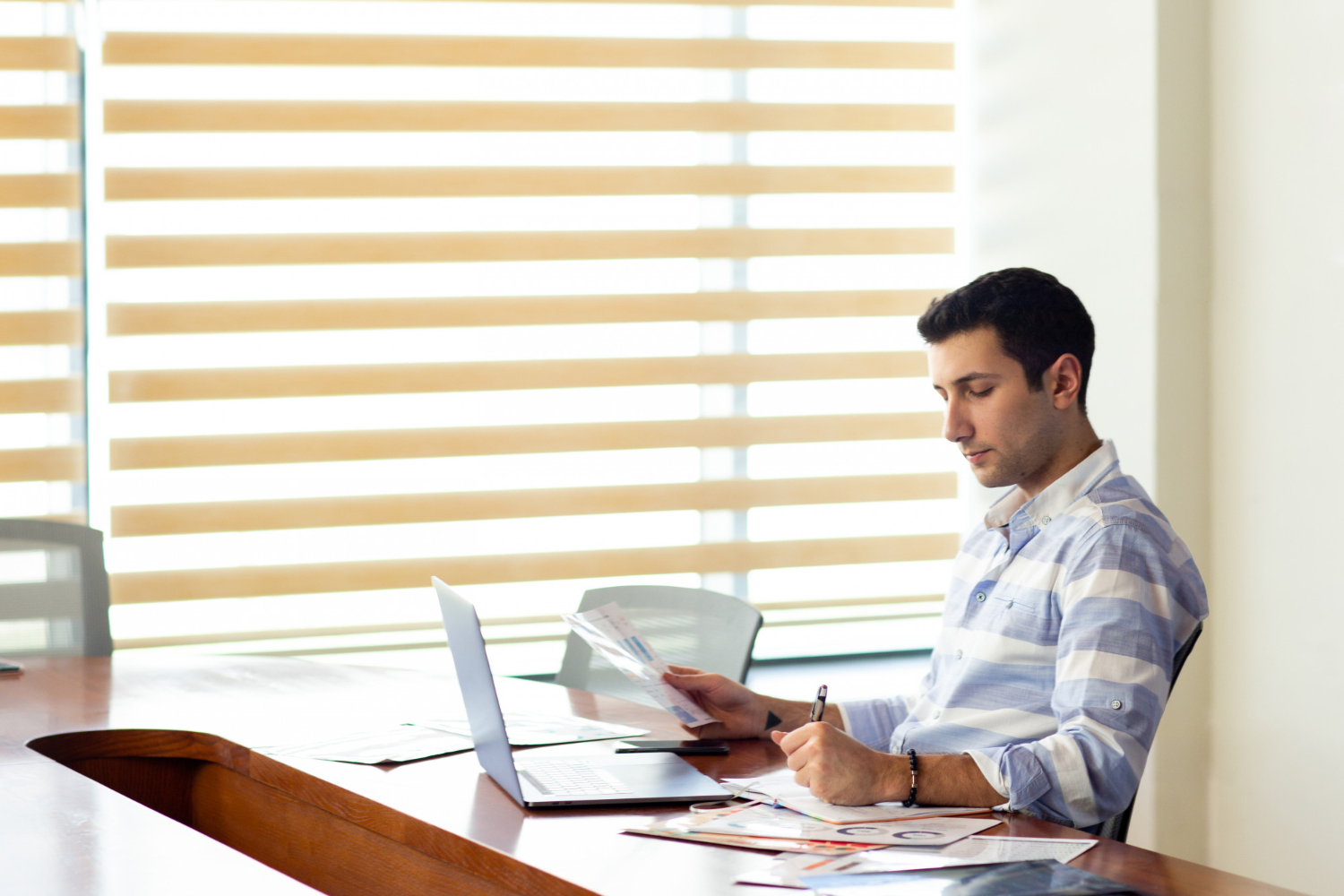 Small business owner analyzing cash flow mistakes in financial reports