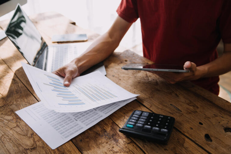 Business owner discussing invoice factoring misconceptions with financial advisor