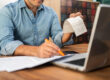 Small business owner using Invoice Factoring California to improve cash flow