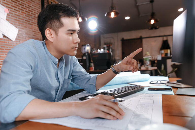 Tech startup team using invoice factoring tech industry solution to improve cash flow