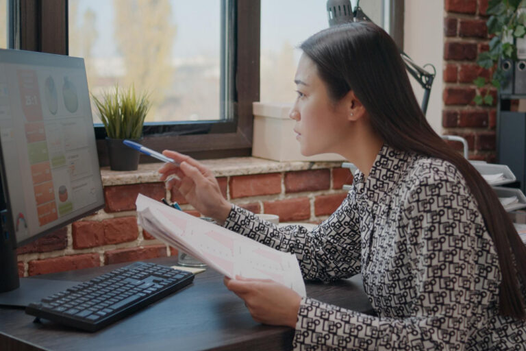 Small business owner using seasonal business invoice factoring to manage cash flow