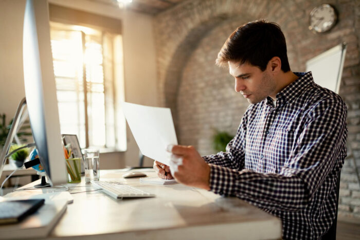 Business owner using invoice data to improve cash flow without more debt