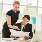 Business owner using factoring to take on bigger clients with confidence