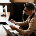 Business owner planning tax season cash flow with invoice factoring