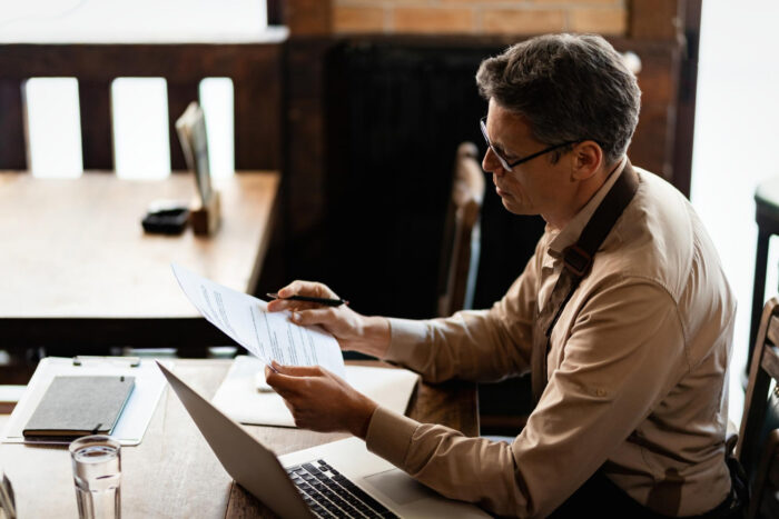 Business owner planning tax season cash flow with invoice factoring