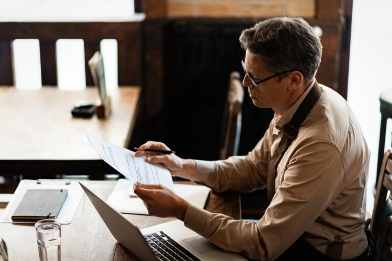 Business owner planning tax season cash flow with invoice factoring