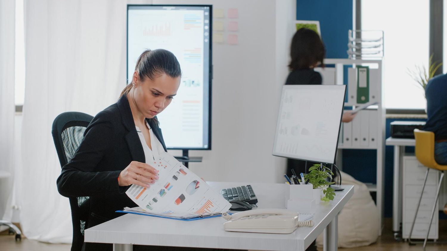 Business owner reviewing invoice factoring signs and cash flow pressure