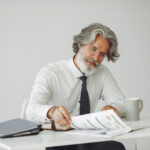 Business owner planning contract growth with stronger cash flow