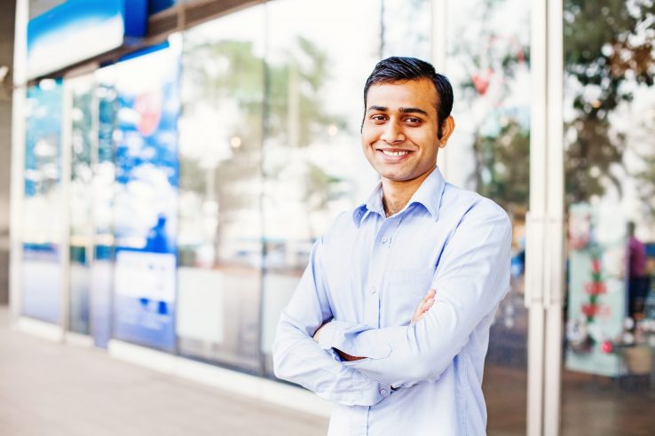 Photo of confident business owner illustrates blog: "4 Accounts Receivable Tips for Small Businesses"