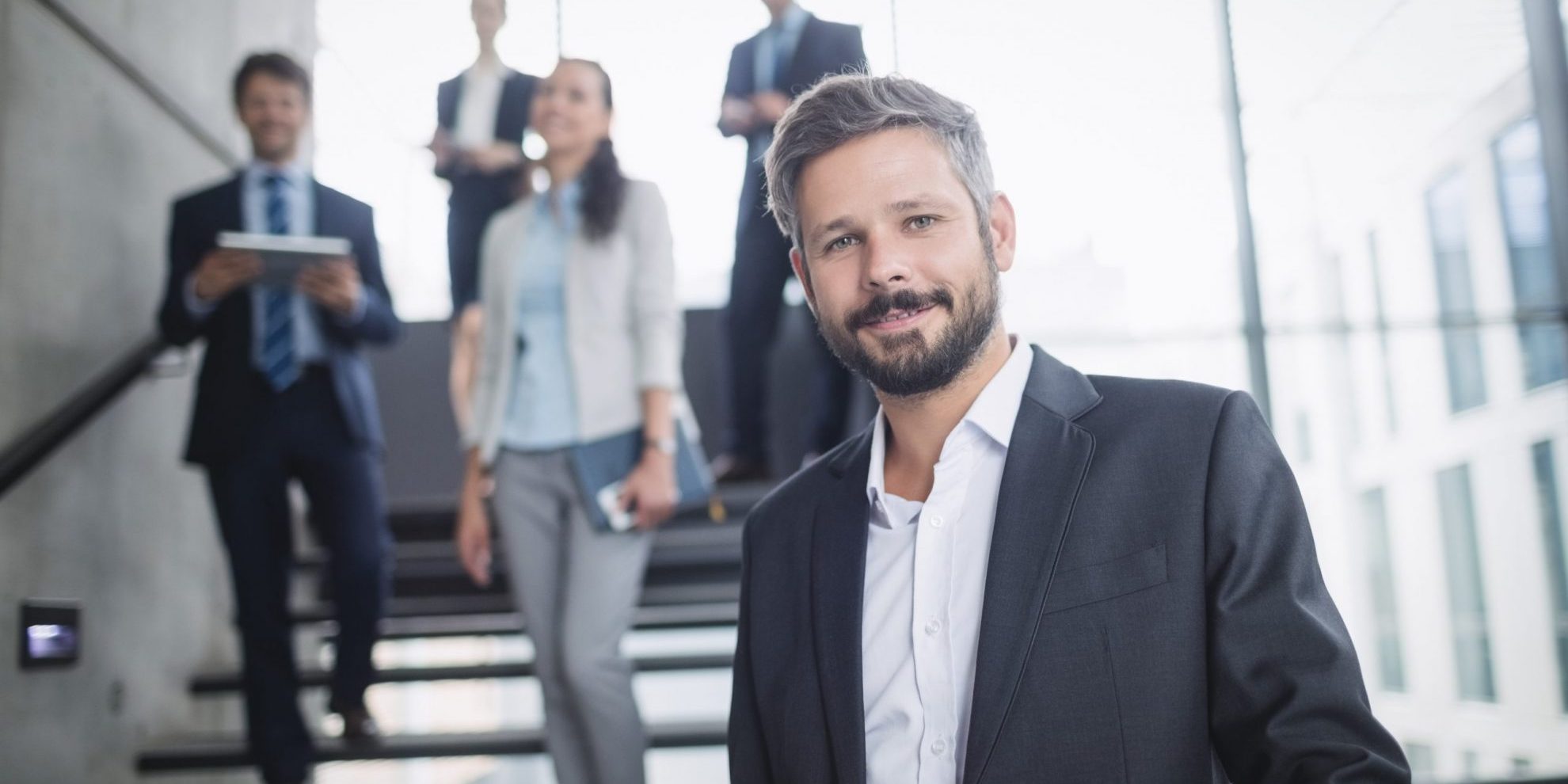 Image of confident entrepreneur illustrates blog: "4 Cash Flow Mistakes Small Business Owners Should Avoid"