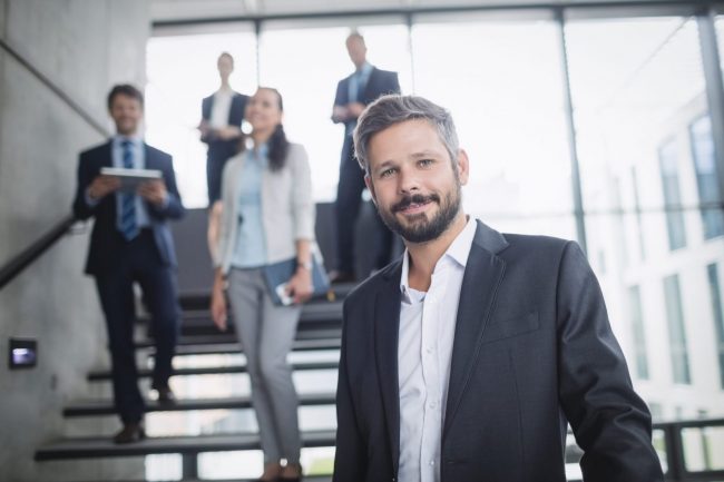 Image of confident entrepreneur illustrates blog: "4 Cash Flow Mistakes Small Business Owners Should Avoid"