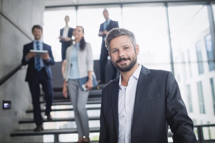 Image of confident entrepreneur illustrates blog: "4 Cash Flow Mistakes Small Business Owners Should Avoid"