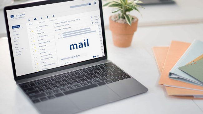 : "How To Write an Email To Remind Customers of Overdue Invoices"Photo of laptop with screen that reads "mail" illustrates blog
