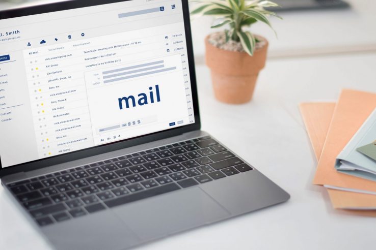 : "How To Write an Email To Remind Customers of Overdue Invoices"Photo of laptop with screen that reads "mail" illustrates blog