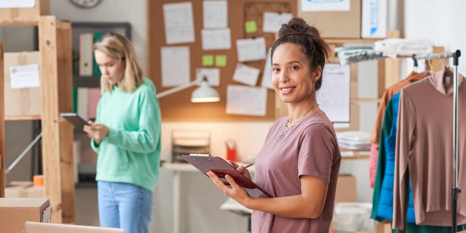 Photo of two businesswomen illustrates blog: How to Tell If Invoice Factoring Is a Good Idea for Your Business