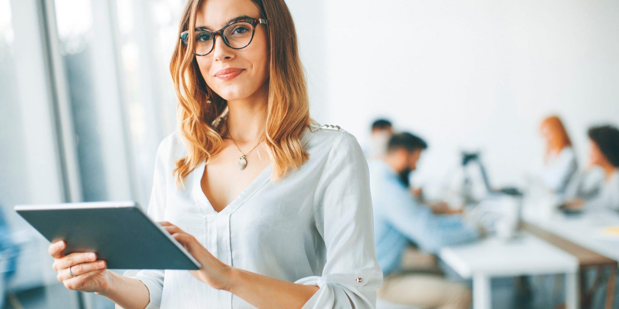 Confident businesswoman illustrates blog: What Is Non-Recourse Factoring?