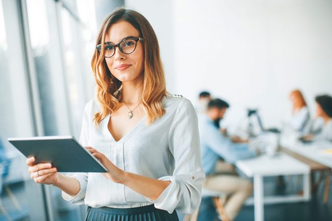 Confident businesswoman illustrates blog: What Is Non-Recourse Factoring?