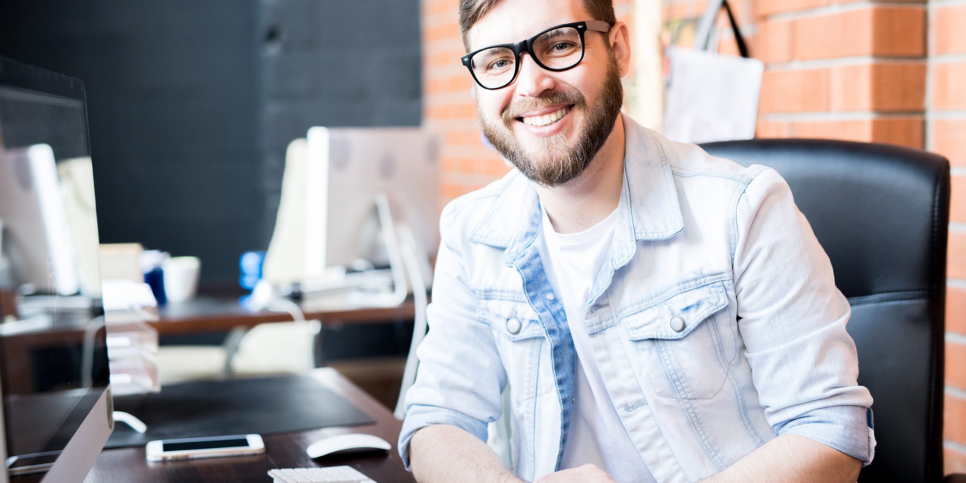 Photo of smiling man illustrates blog: "Receivables Factoring vs Receivables Securitization: What Is the Difference?"