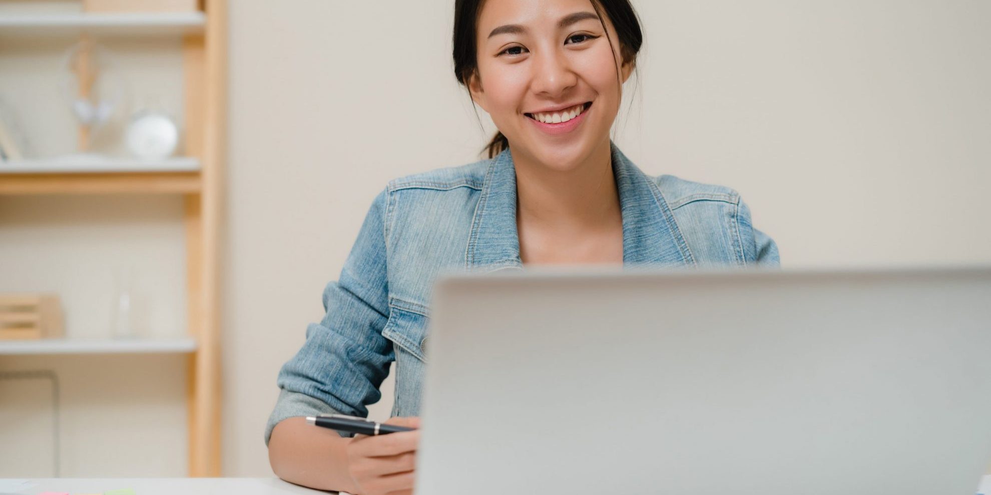 Image of smiling young businesswoman illustrates blog: "Factoring for new businesses: is it a good idea?"