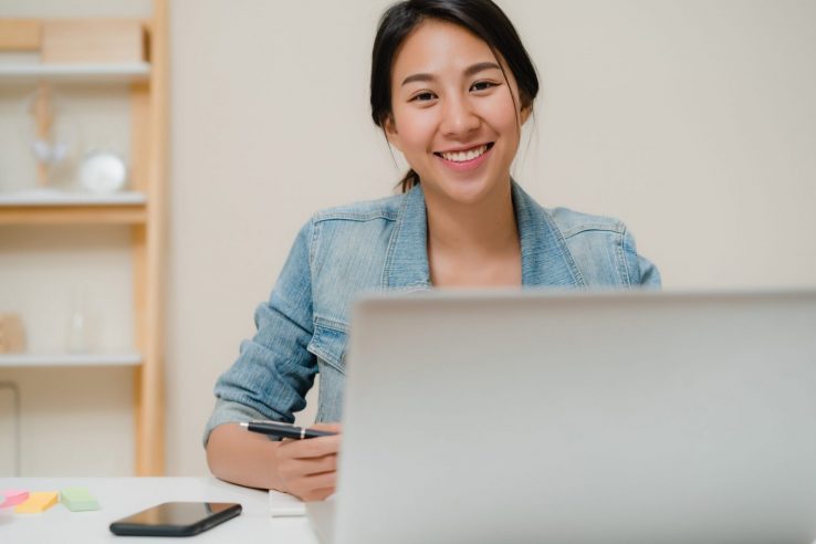 Image of smiling young businesswoman illustrates blog: "Factoring for new businesses: is it a good idea?"