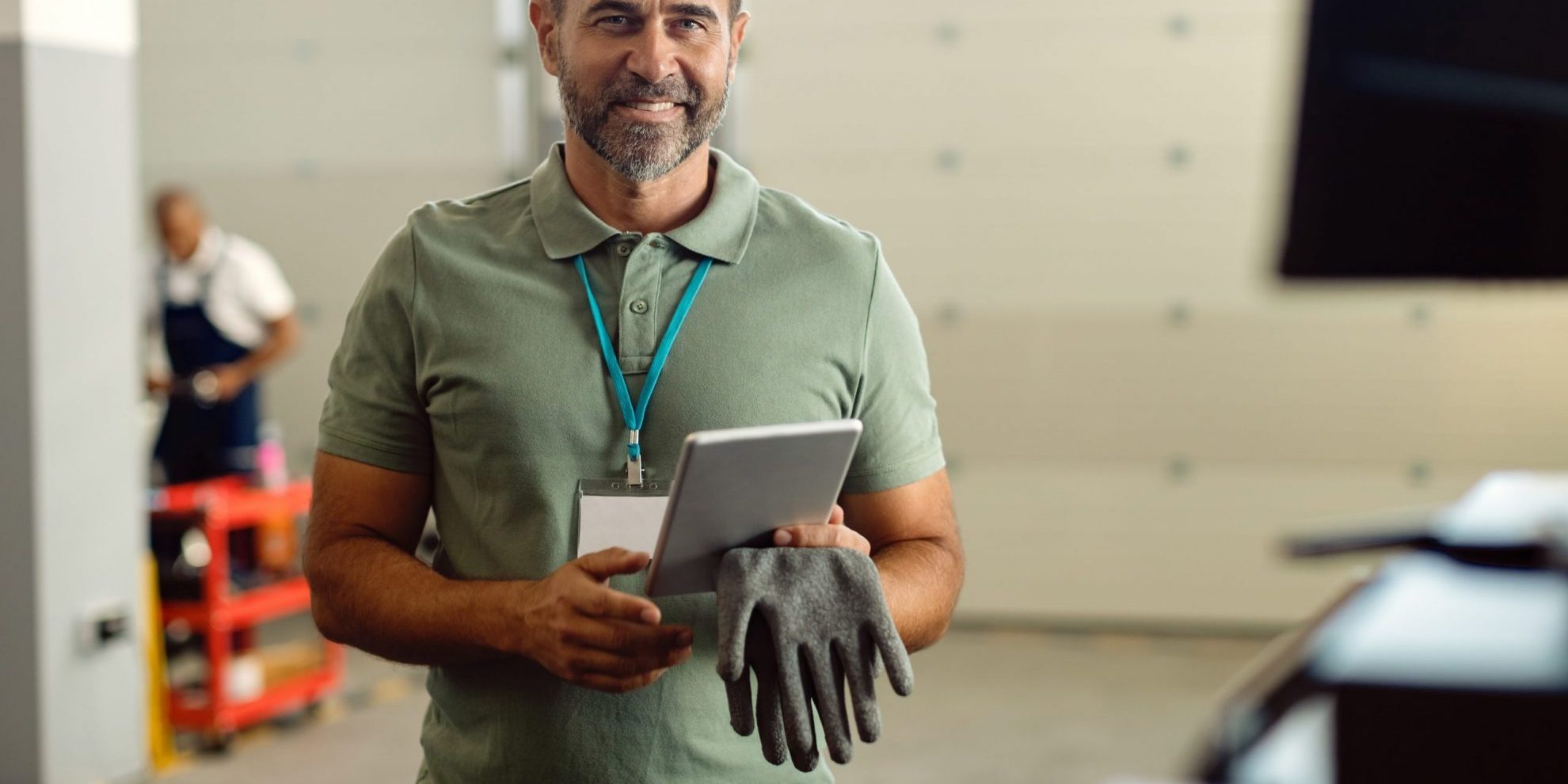 Photo of smiling business owner illustrates blog: "Small Businesses Can Benefit From Using Factoring To Pay Operating Expenses"