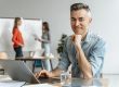 Man in office illustrates blog "What Does It Mean When Accounts Receivable Are Factored With Recourse?"