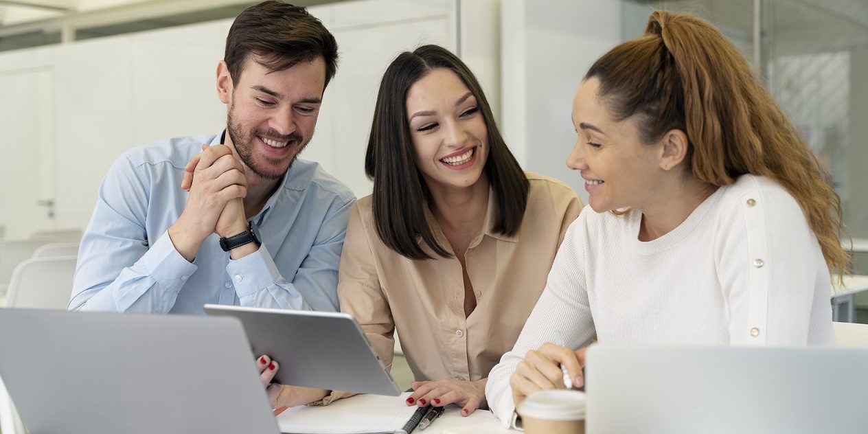 office-people-freepik Two women and a man in office.
